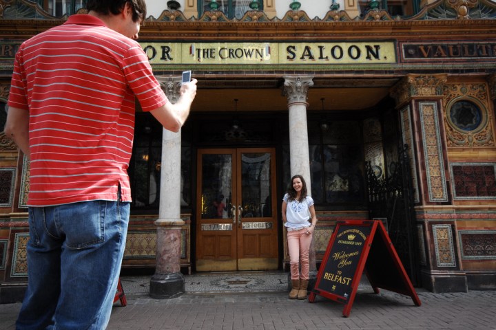 a man and a woman standing in front of a store