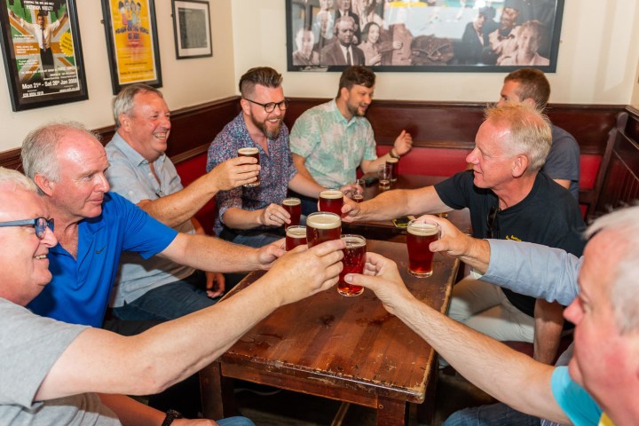 men having a toast with beer