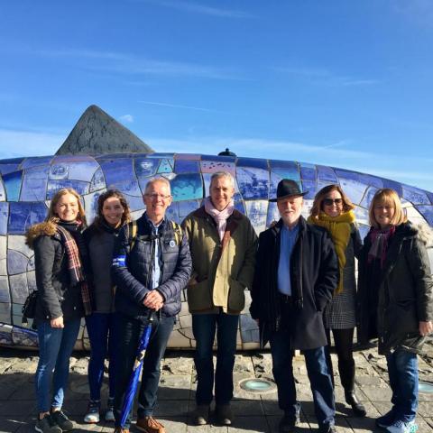 group in front of the big fish monument