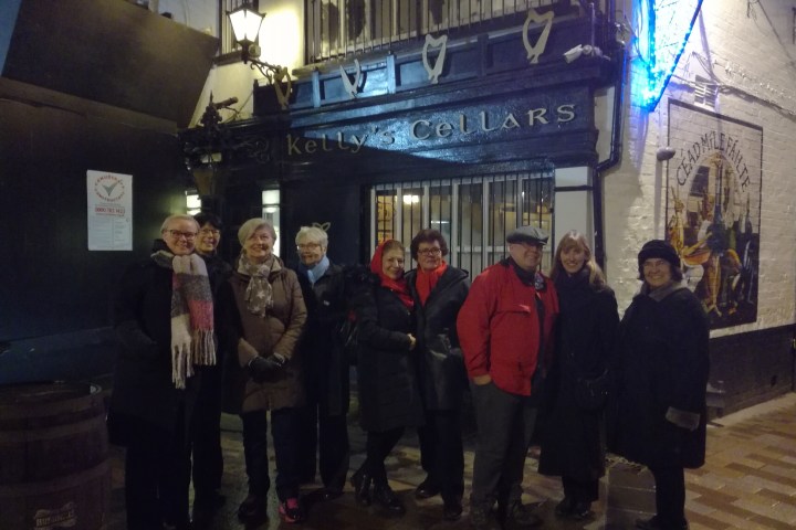 a group of people standing in front of a building