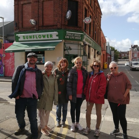 group in front of a irish pub