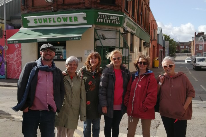 group in front of a irish pub
