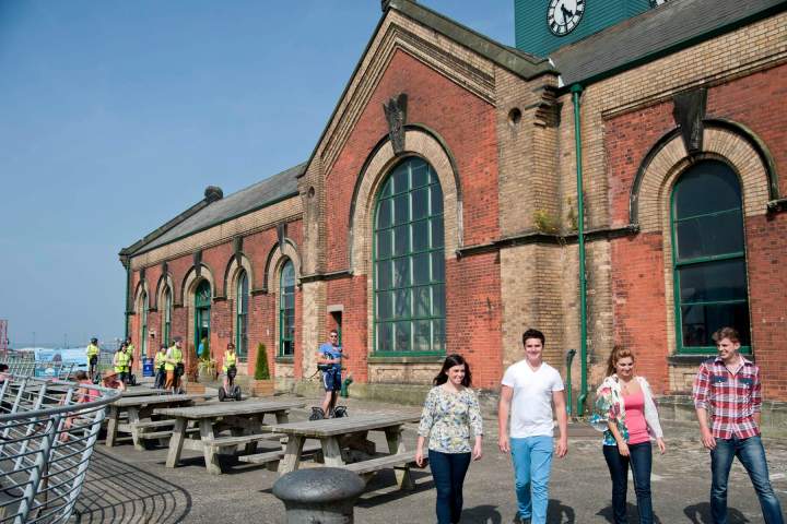 a group of people standing in front of a building