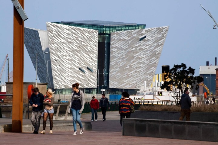 a group of people standing in front of a building